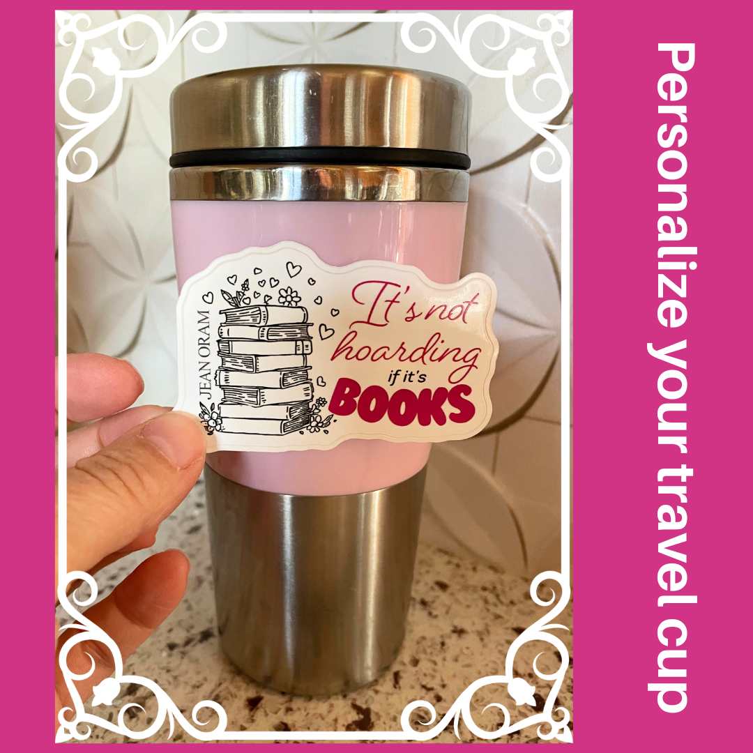 Pink travel mug with a sticker reading 'It's not hoarding if it's books' by Jean Oram
