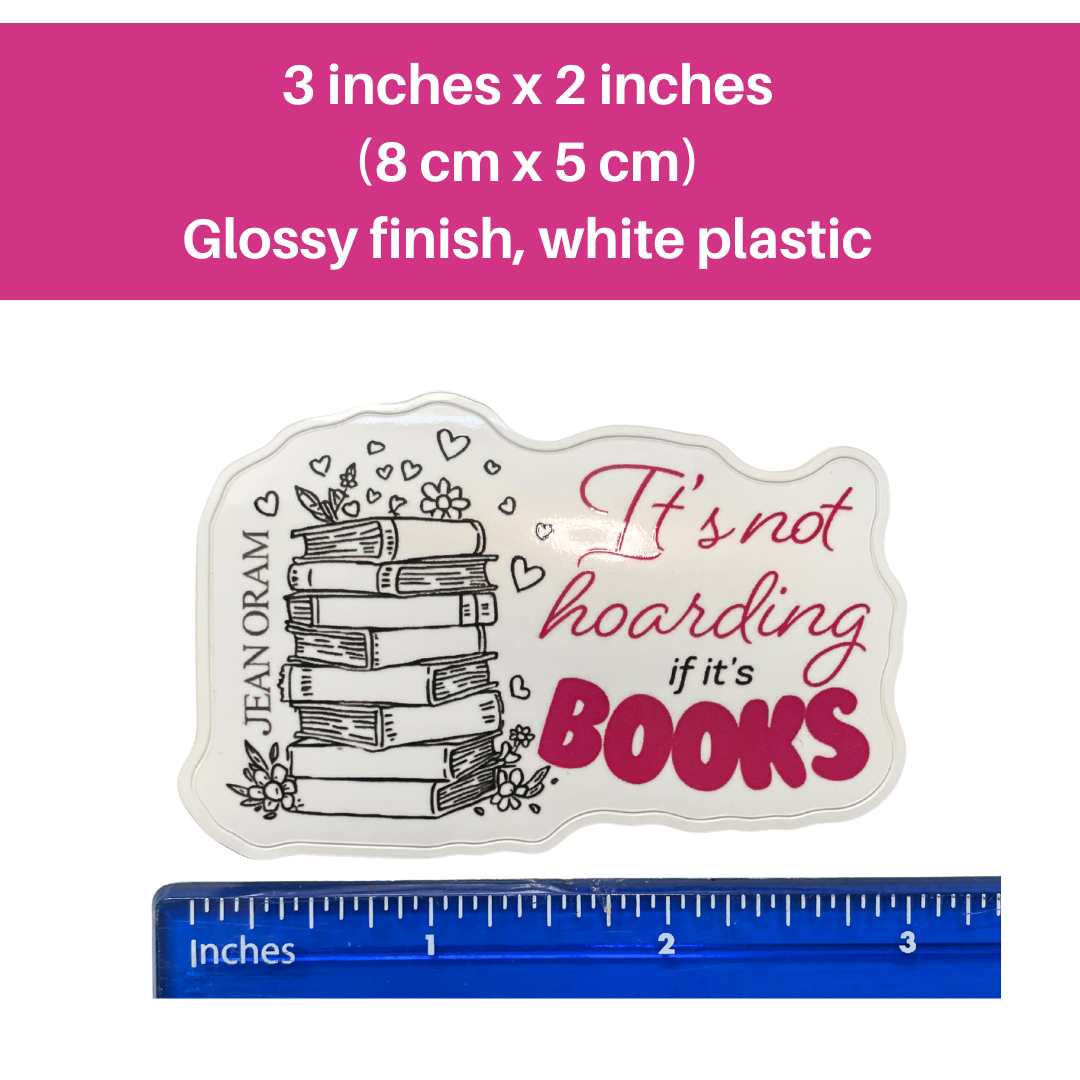 White plastic item with 'It's not hoarding if it's books' text, ruler for scale, and product details on a pink background